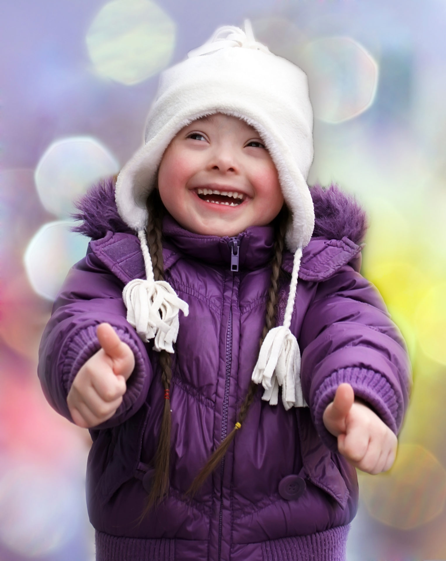 Portrait of beautiful happy girl giving thumbs up.